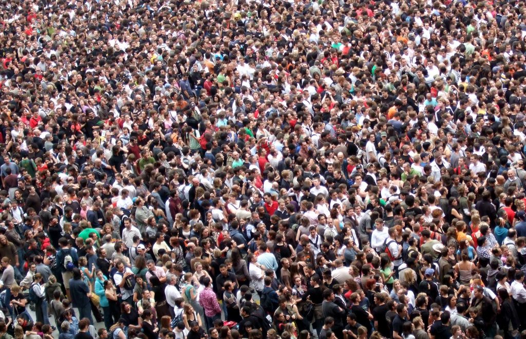Picture of a dense crowd of people at a Muse Concert. 